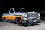 C10 squarebody lowered pickup orange stripe pro touring wheels front three quarter view
