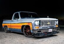 C10 squarebody lowered pickup orange stripe pro touring wheels front three quarter view