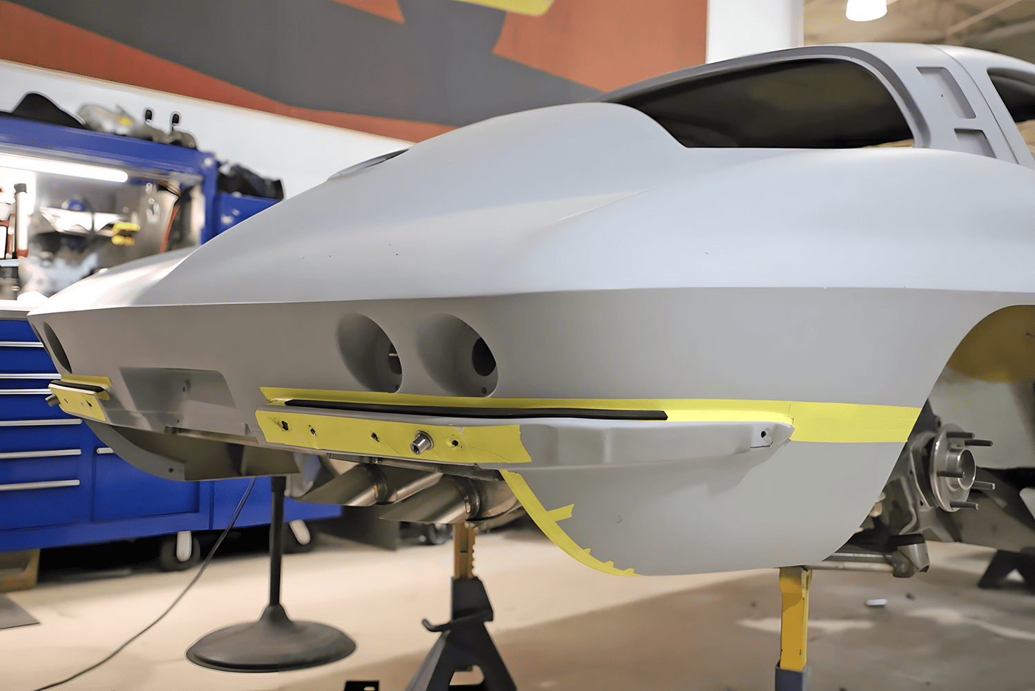 C2 Corvette rear body in primer bumper mounting plate mockup exhaust outlet openings