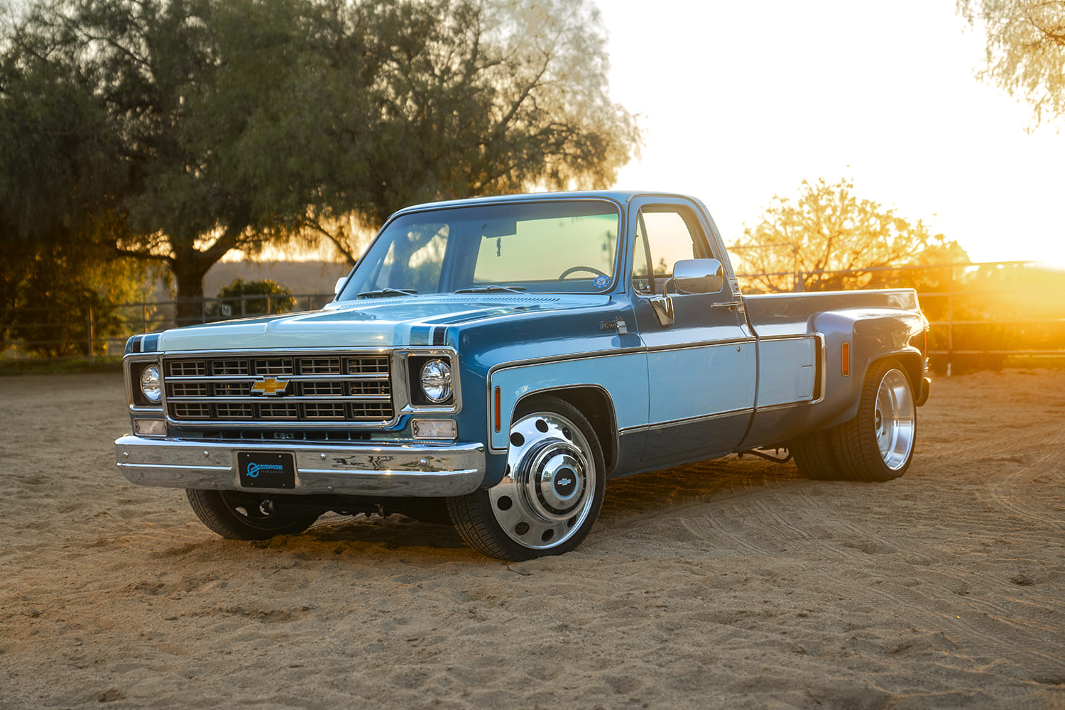 1976 c10 custom dually pickup golden hour front side angle polished wheels lowered stance