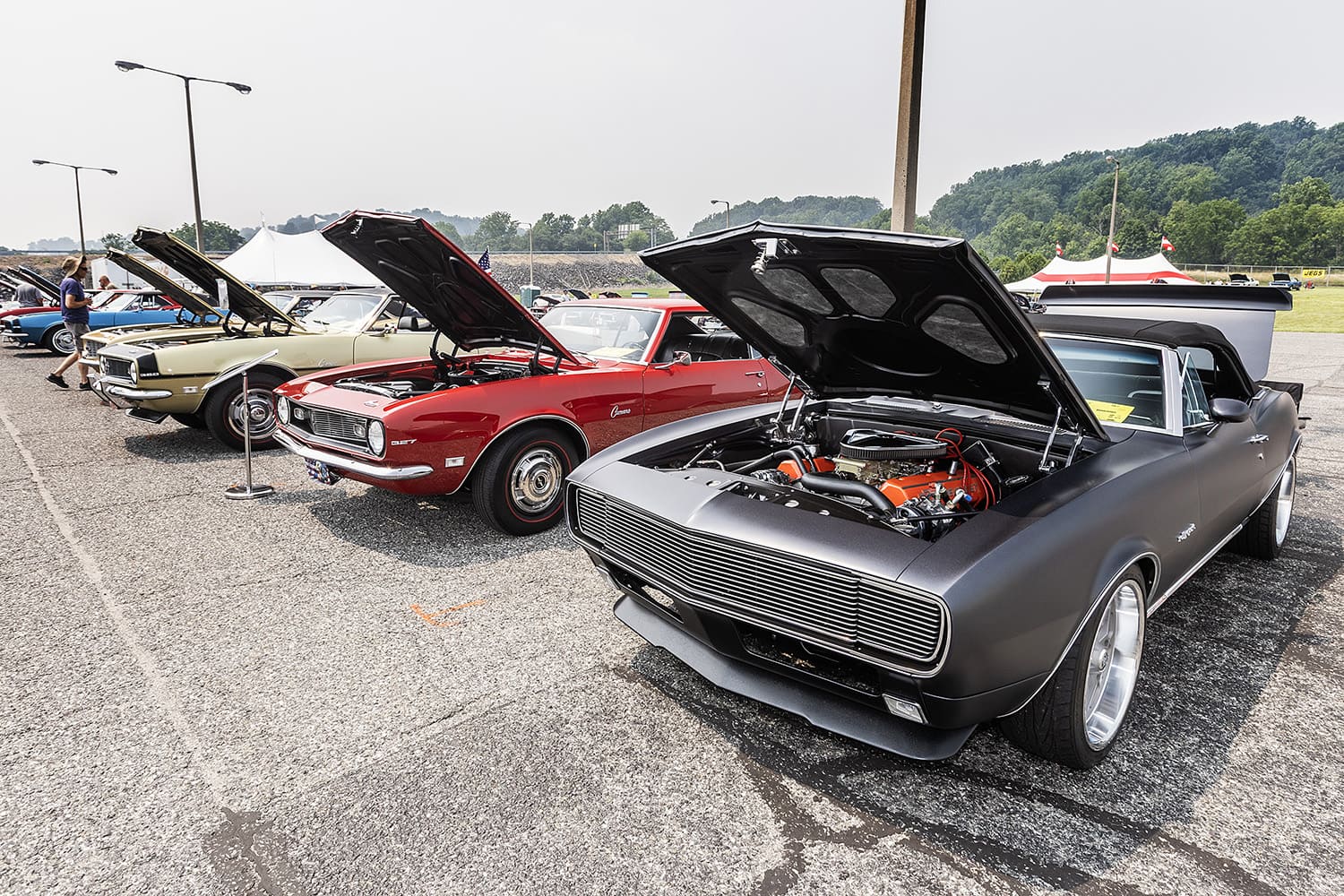 stock 68 camaro next to custom 67 camaro