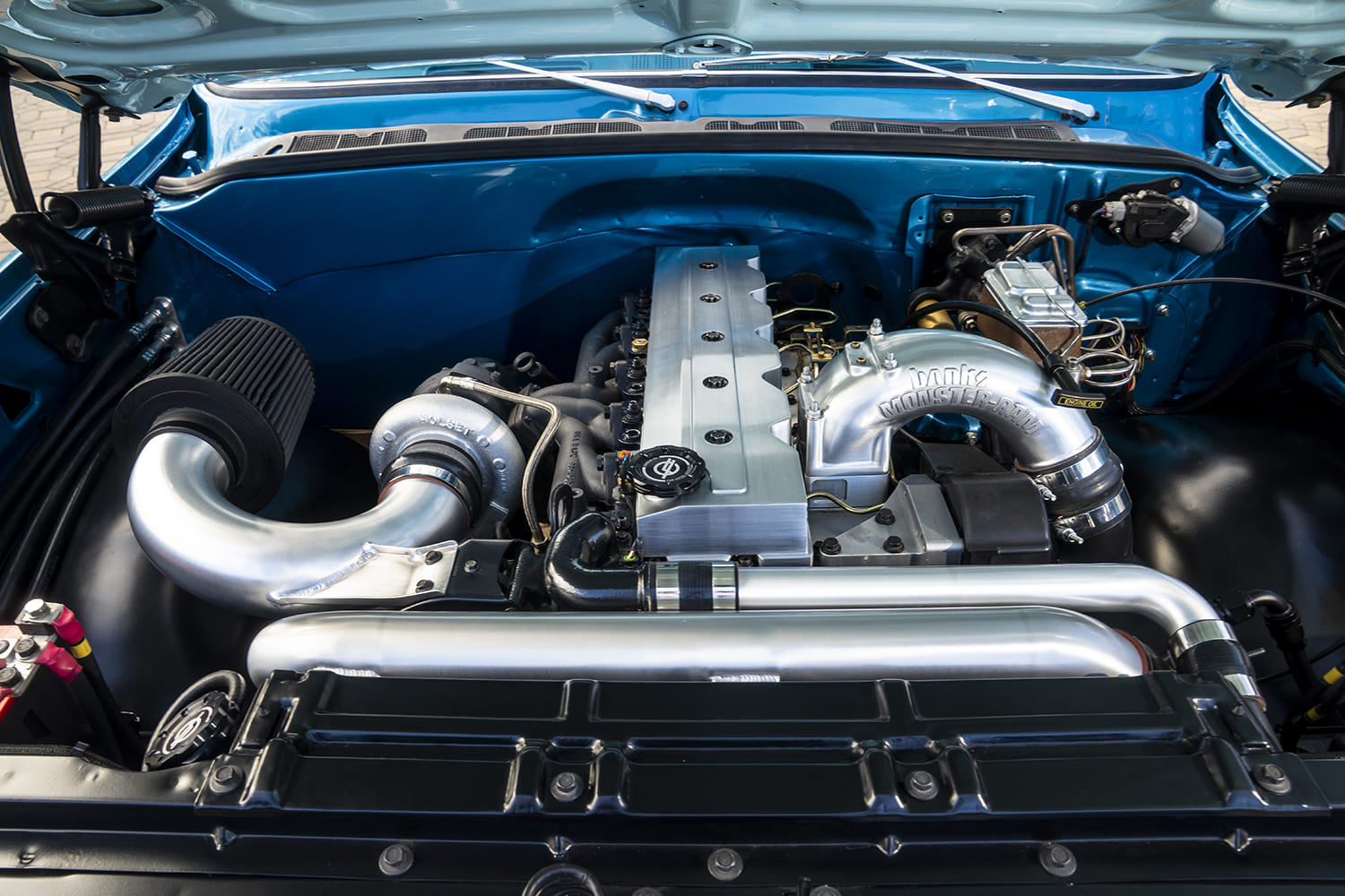 dually engine bay turbocharged inline setup polished piping detail