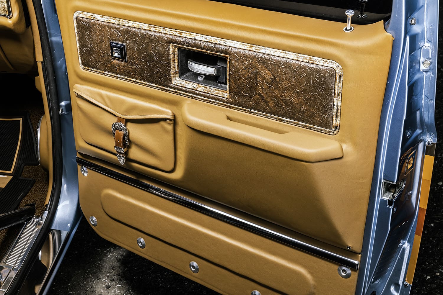 11 1982 Chevrolet C10 custom door panel tan leather embossed trim interior detail close up