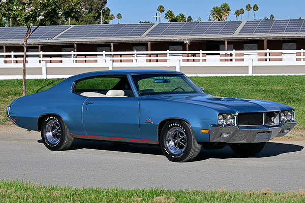 Front three-quarter view of Steve Aguilar’s metallic blue 1970 Buick GS Stage 1 muscle car parked on the asphalt at the Goodguys Pleasanton West Coast Nationals.