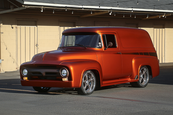 Front three-quarter view of Steve Castello’s custom metallic copper-orange 1956 Ford panel truck parked outdoors at the Goodguys Pleasanton West Coast Nationals.