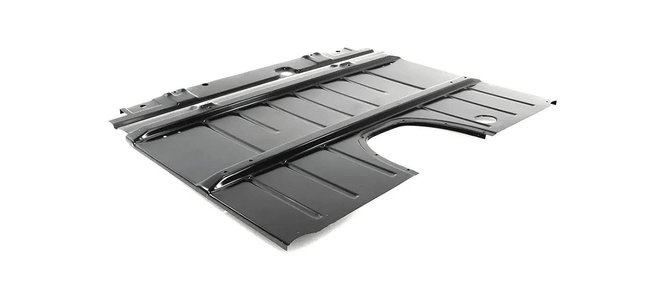 Studio product shot of a full black EDP-coated replacement steel cab floor pan assembly for a 1955-1959 Chevrolet Task Force pickup truck on a white background.