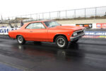 orange chevelle street strip car launching at the drag strip