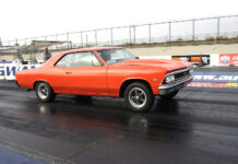 orange chevelle street strip car launching at the drag strip