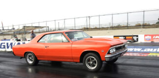 orange chevelle street strip car launching at the drag strip