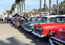 Giving Recognition To All Local Cruise-in Organizers a row of tri-five Chevy customs at a local car show and cruise in with palm trees in San Diego