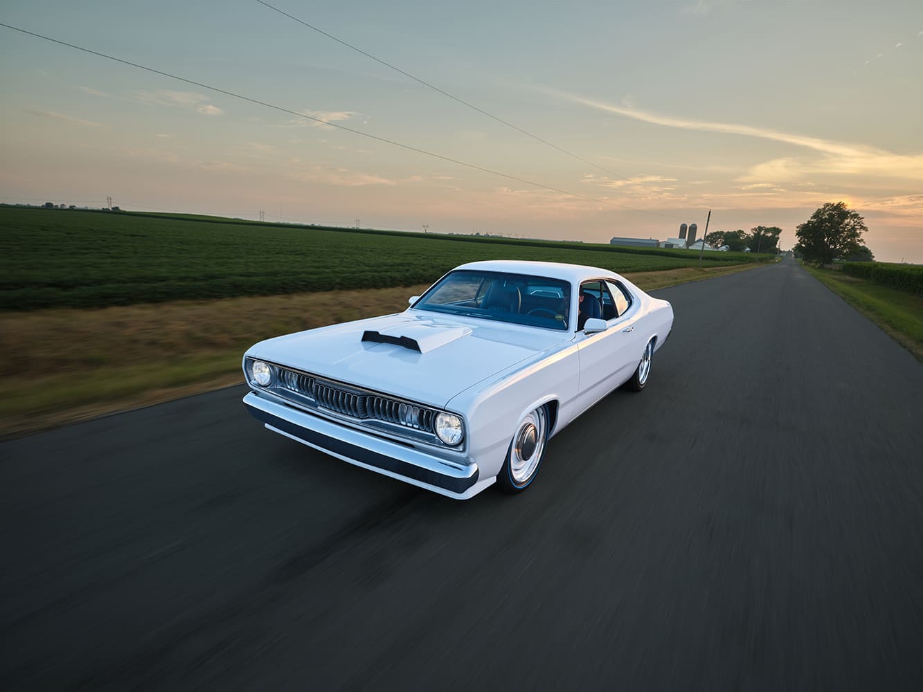 1971 Plymouth Duster white custom driving rural road sunset pro touring muscle car lowered stance