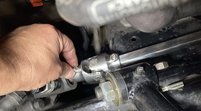 1967 Chevelle Steering Shaft Install Hand aligning the lower universal joint and polished Double D shaft onto the steering box splines next to the tubular control arm mount.