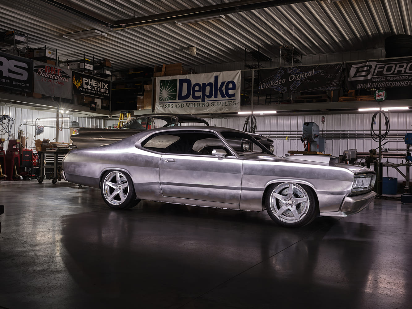 1971 Plymouth Duster custom bare metal build shop scene widebody wheels fabrication garage project car