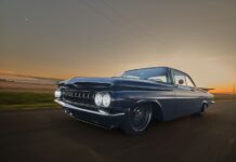 1959 Chevrolet Impala low angle front driving photo blue custom coupe sunset road motion blur