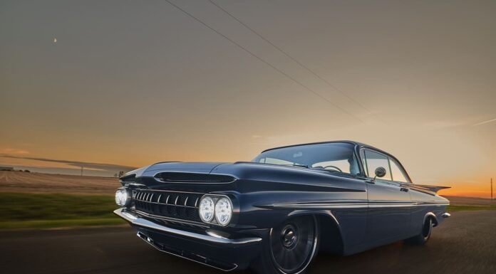 1959 Chevrolet Impala low angle front driving photo blue custom coupe sunset road motion blur