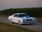1971 Plymouth Duster white custom front view roadside cornfield headlights on pro touring muscle car