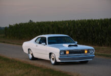 Hellcat-Powered 1971 Plymouth Duster with a Modern Chassis 1971 Plymouth Duster white custom front view roadside cornfield headlights on pro touring muscle car