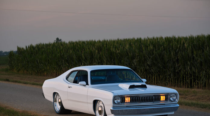 1971 Plymouth Duster white custom front view roadside cornfield headlights on pro touring muscle car