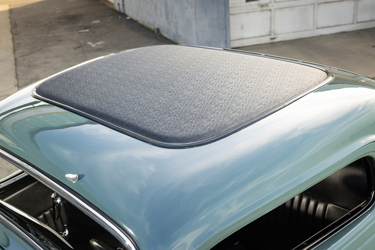 Close-up overhead shot of the black textured vinyl fabric roof insert on the chopped cab of a custom 1933 Ford 3-Window Coupe.