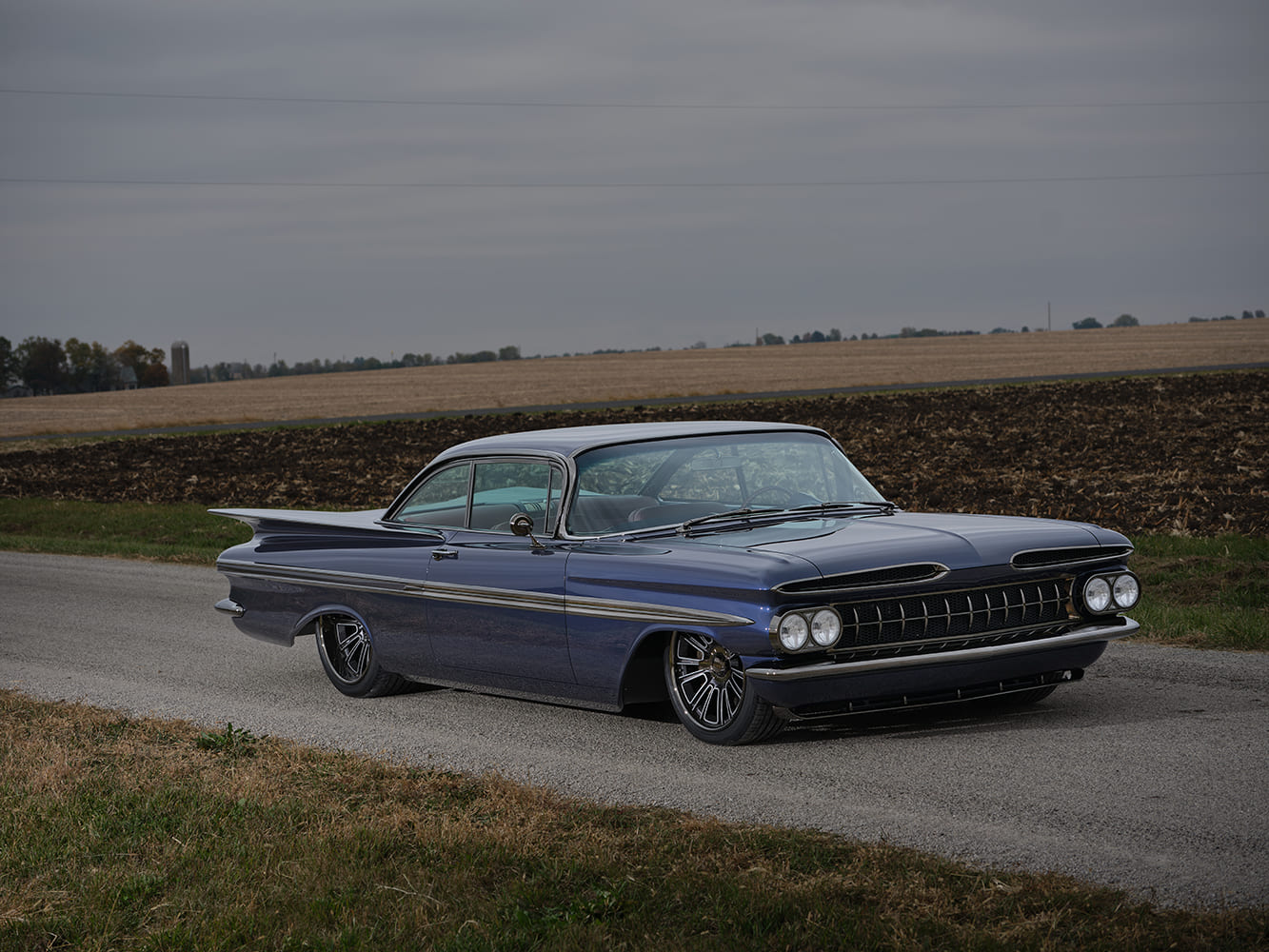 1959 Chevrolet Impala front three quarter parked shot lowered blue custom hardtop roadside farmland background