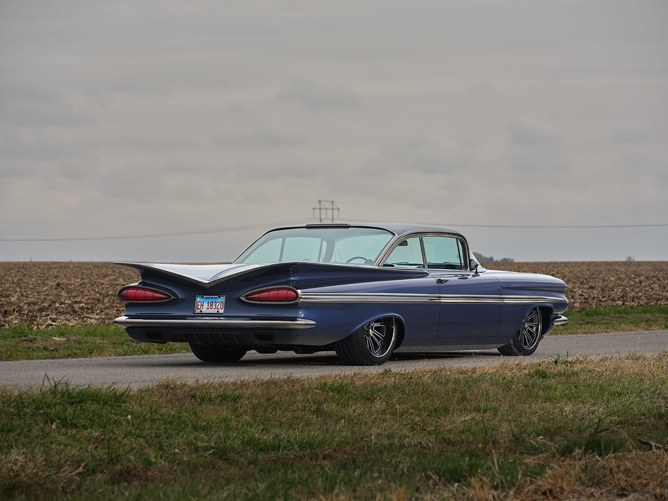 1959 Chevrolet Impala rear three quarter parked photo iconic batwing fins blue custom coupe