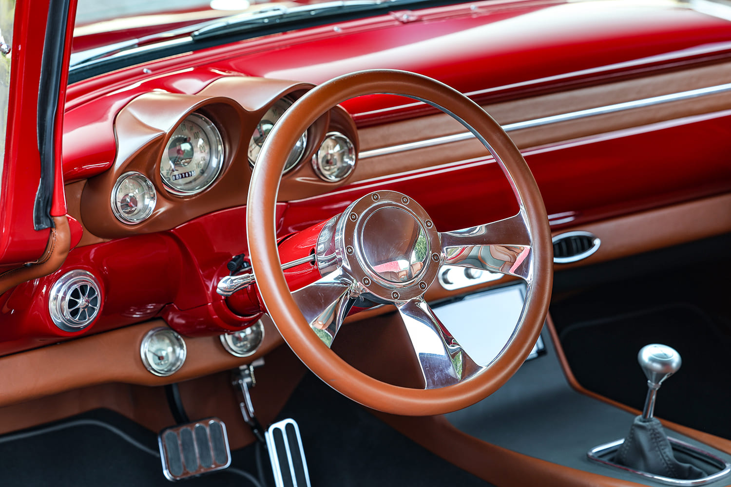55 Chevrolet Bel Air custom dashboard steering wheel brown leather interior classic hot rod gauge cluster detail
