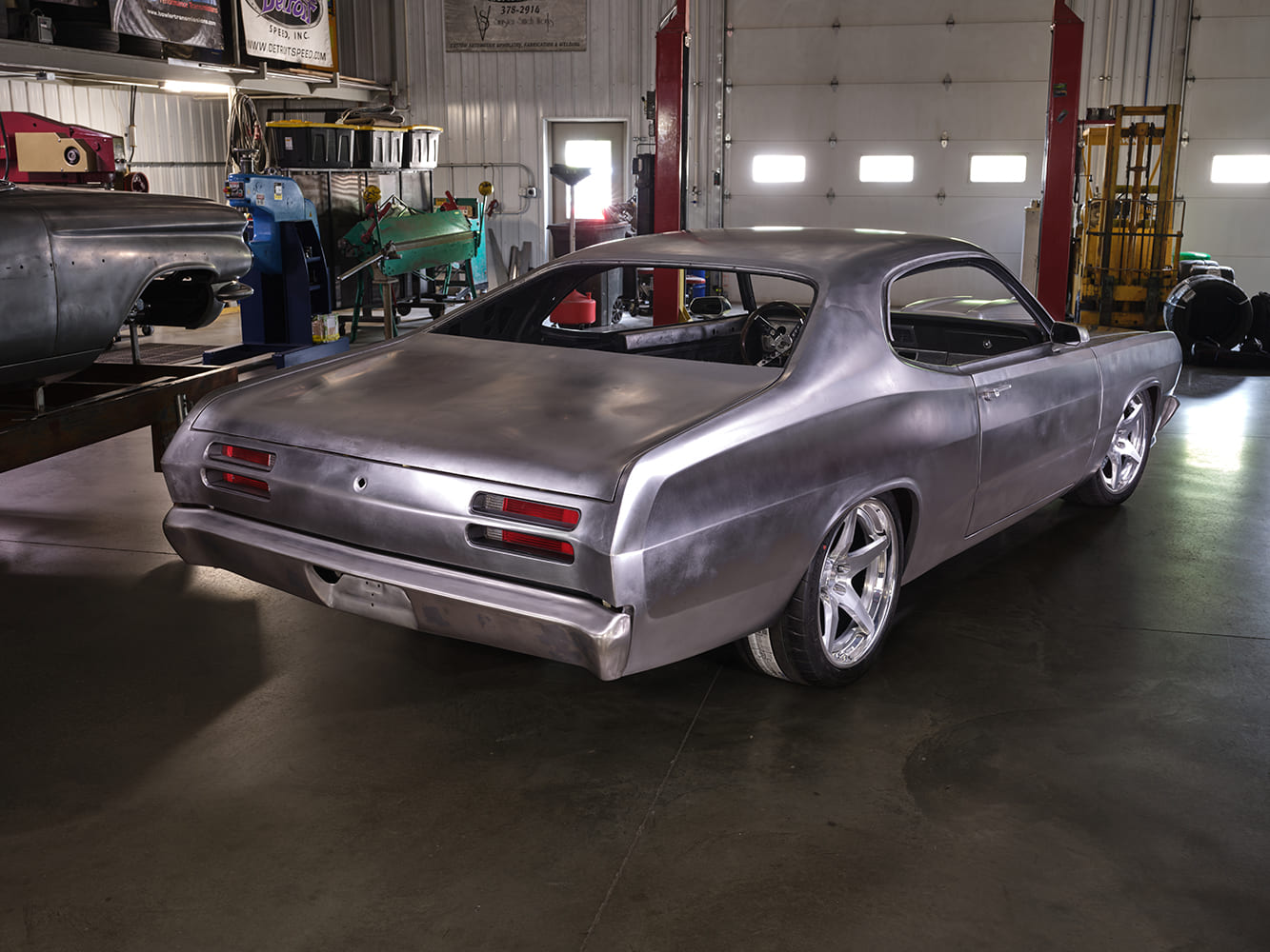 1971 Plymouth Duster rear view bare metal custom build shop widebody wheels fabrication project