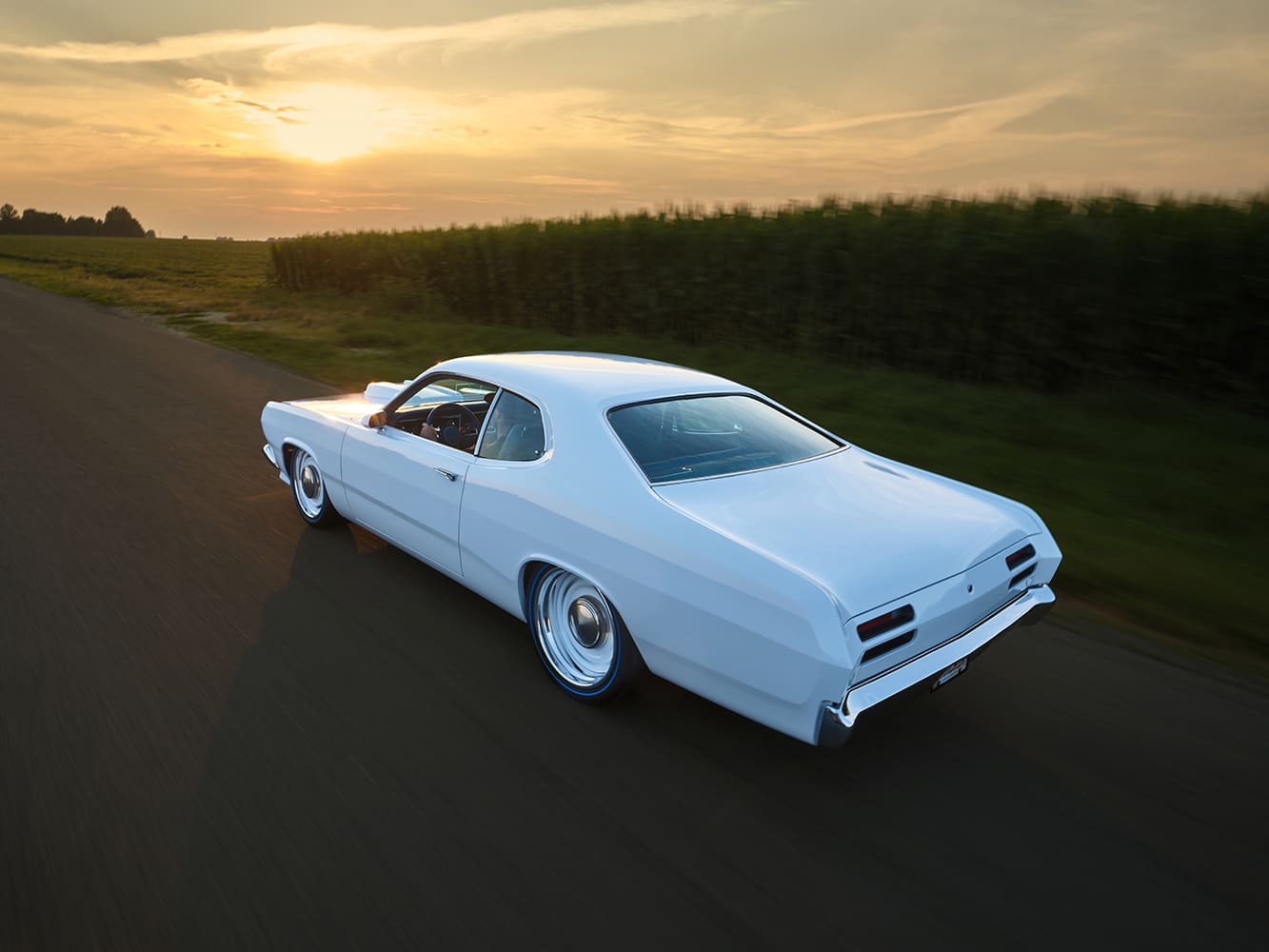 1971 Plymouth Duster white custom rear rolling shot sunset countryside pro touring muscle car stance