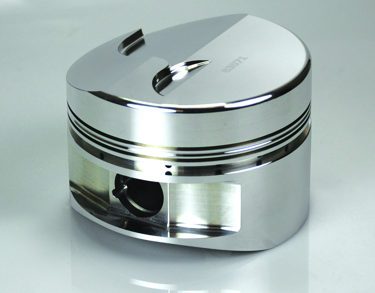 forged aluminum racing piston for 409 engine with valve reliefs.