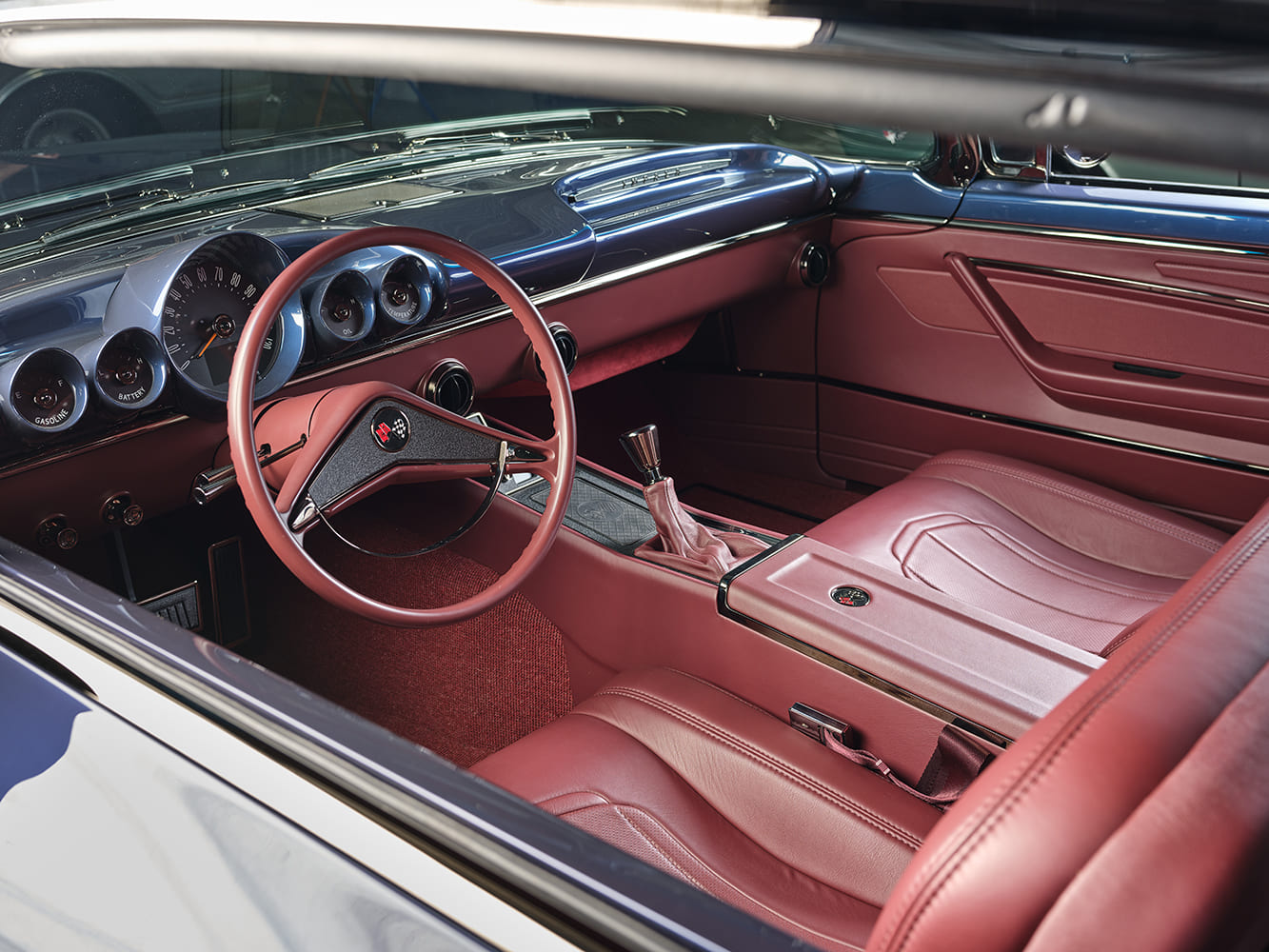 1959 Chevrolet Impala interior wide view red leather custom cabin manual shifter classic dashboard