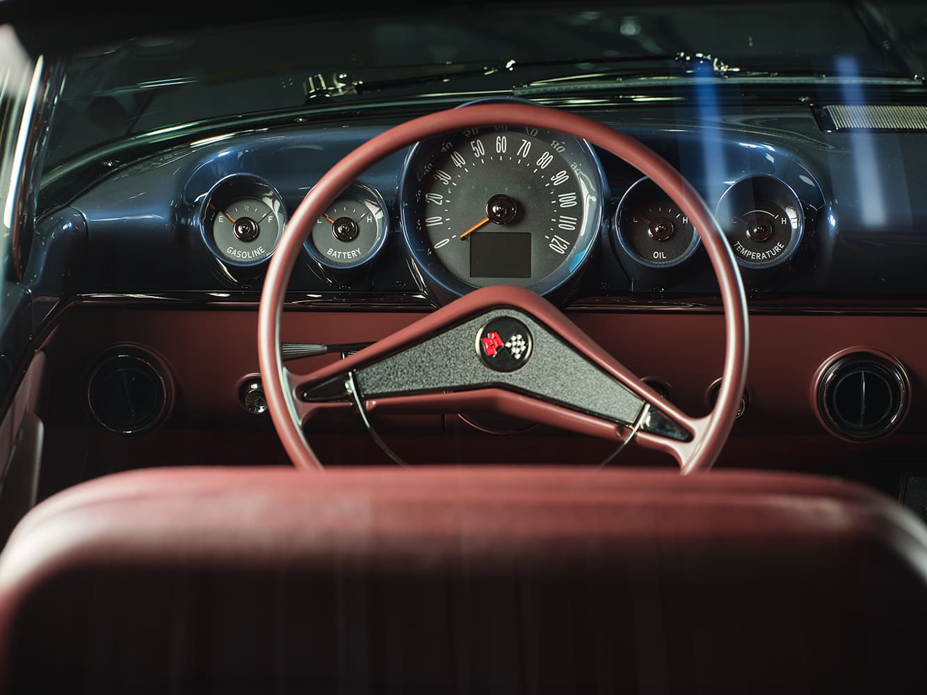 1959 Chevrolet Impala dashboard steering wheel view custom gauges red interior classic cockpit