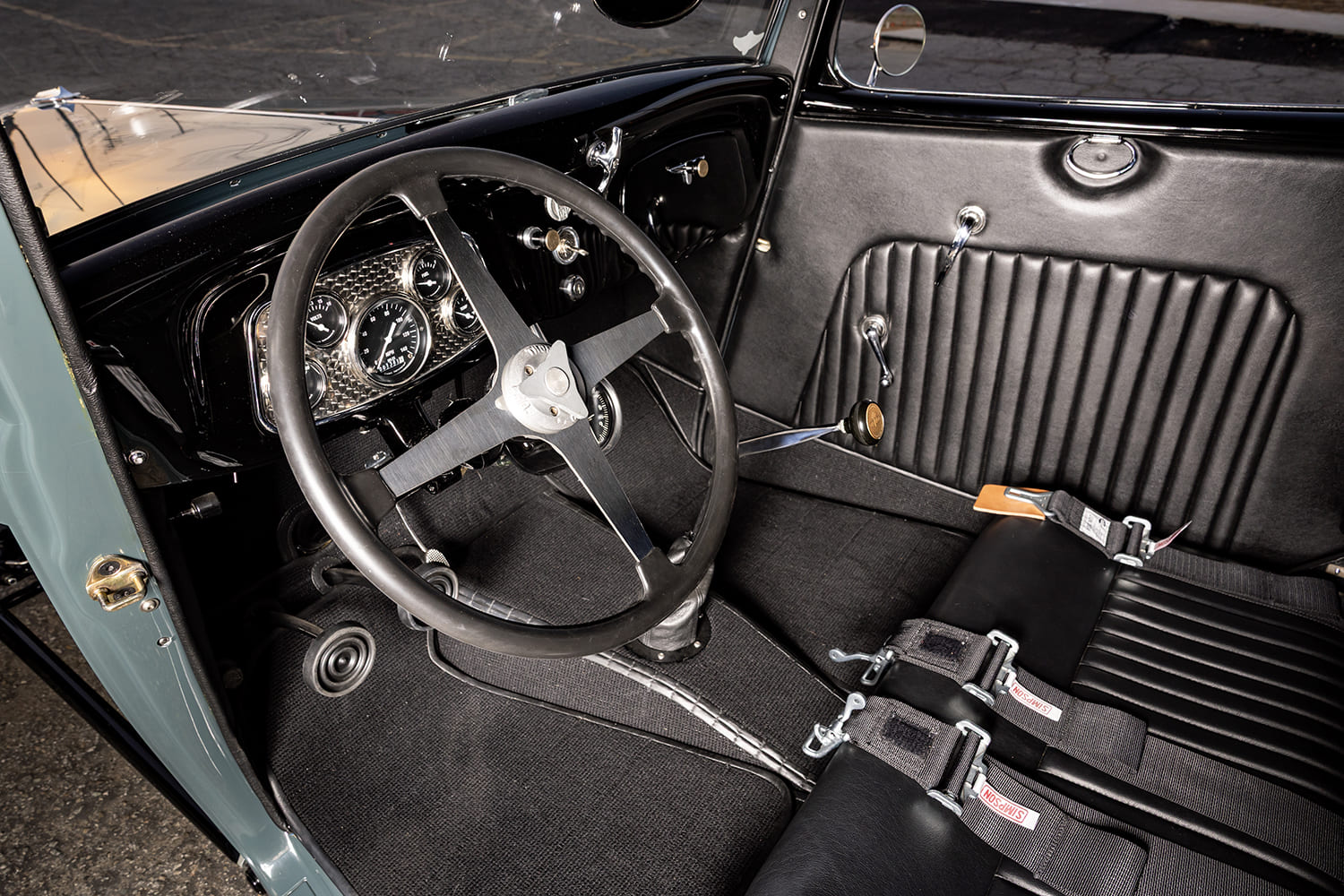 1933 Ford Coupe hot rod interior seats harness belts black upholstery custom cabin