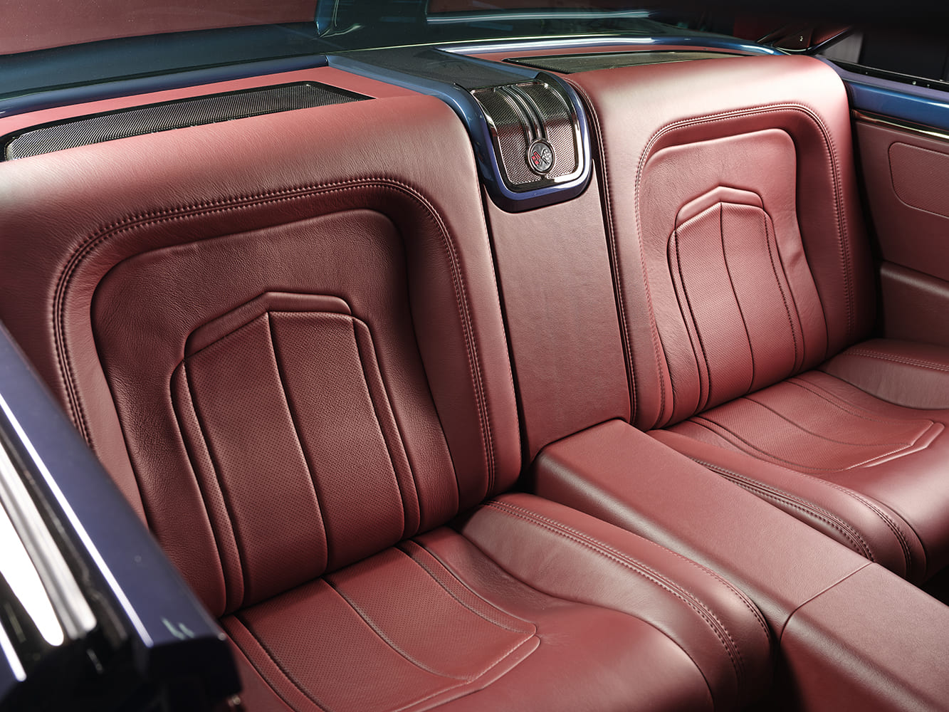 1959 Chevrolet Impala rear seats red leather upholstery custom interior stitching classic coupe cabin