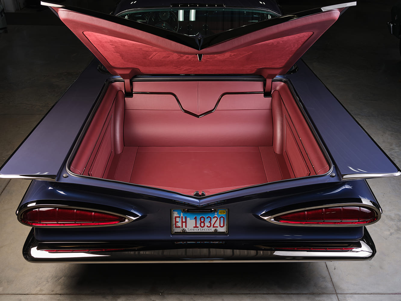 1959 Chevrolet Impala trunk open view red upholstered cargo area custom show car finish