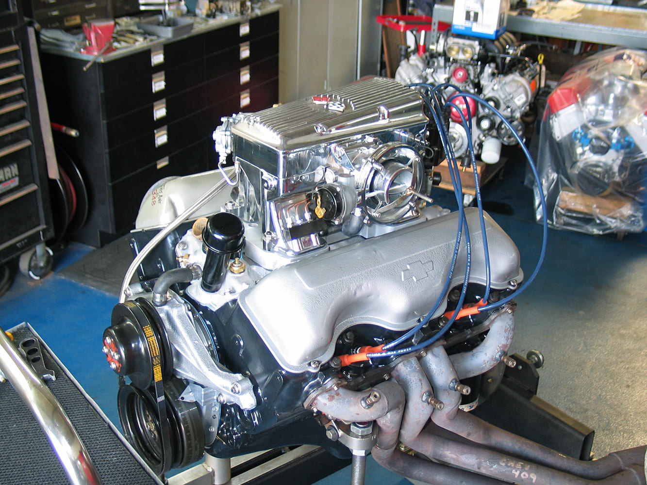 rochester fuel injection installed on a 409 engine with silver painted valve covers by John Beck.