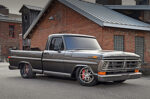 Dylan Keindl’s Restored 1972 F-100 Ford Bumpside Low front three-quarter angle of a custom metallic gray 1972 Ford F-100 pickup showing large Wilwood disc brakes behind brushed wheels.