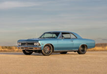 Ground-level front three-quarter angle of the 1966 Chevelle SS hardtop displaying its dual headlights, SS 396 grille emblem, and big-and-little tire package under an open sky.