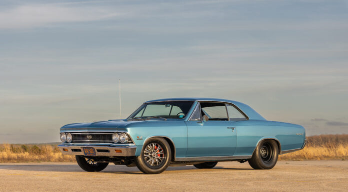 Ground-level front three-quarter angle of the 1966 Chevelle SS hardtop displaying its dual headlights, SS 396 grille emblem, and big-and-little tire package under an open sky.