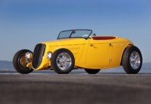 AMBR Contender 1934 Ford Roadster By Roy Brizio Street Rods Is The Best Yet Front three-quarter view of the yellow 1934 Ford AMBR contender featuring custom horizontal grille and open front wheels.
