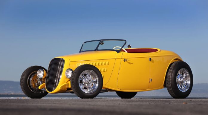 AMBR Contender 1934 Ford Roadster By Roy Brizio Street Rods Is The Best Yet Front three-quarter view of the yellow 1934 Ford AMBR contender featuring custom horizontal grille and open front wheels.