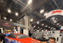 Custom colored car cover hiding JoJo Granatelli's drag car
