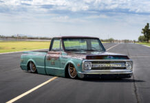 Arizona High Test–built 1969 Chevy C10 Low-angle front three-quarter view of a bagged patina turquoise and brown 1969 Chevrolet C10 pickup laid out on airport runway tarmac.